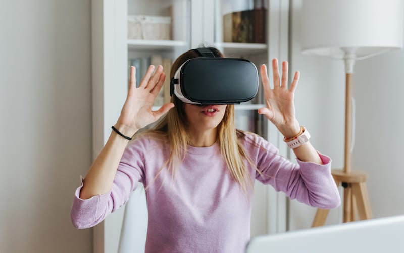 woman using vr goggles